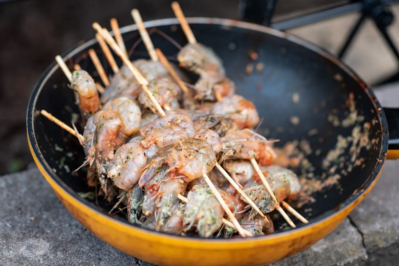 A vibrant bowl of Mexican chicken marinade with fresh herbs, spices, and lime.